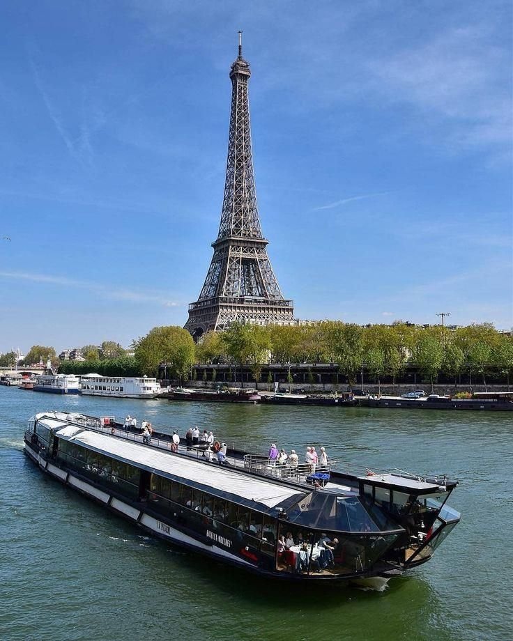 Seine River cruise boat with Eiffel Tower, Paris