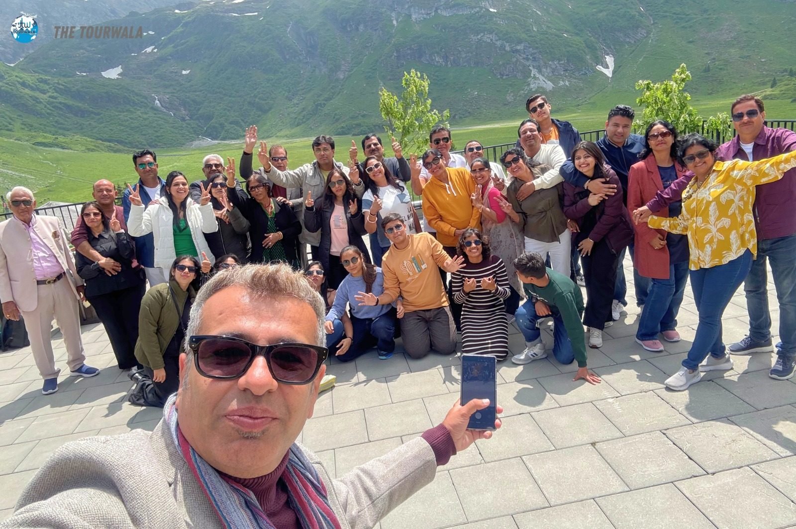 Tourwala travellers taking a group selfie in the Swiss Alps